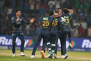 | Photo: AP/Manish Swarup : Gujarat Titans' captain Shubman Gill, left, along with his teammates celebrates after they won the Indian Premier League cricket match against Delhi Capitals in New Delhi.