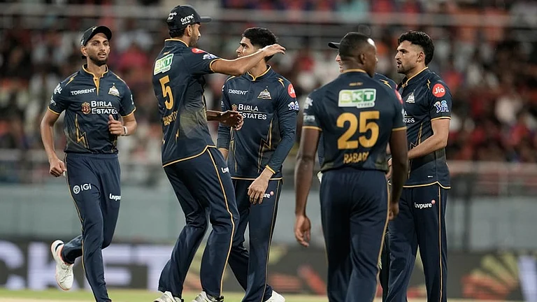 Gujarat Titans' Ashok Sharma, right, celebrates with teammates the wicket of Punjab Kings' Marco Jansen during the Indian Premier League cricket match between Gujarat Titans and Punjab Kings in New Chandigarh. - | Photo: AP/Ashwini Bhatia