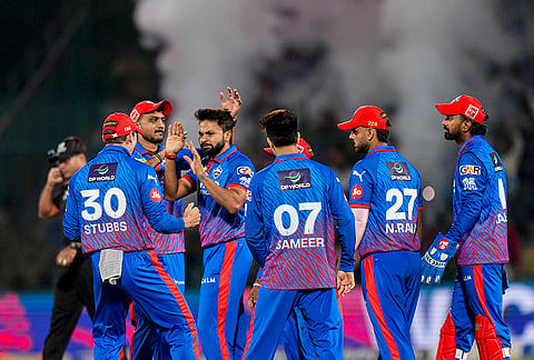 Delhi Capitals' Mukesh Kumar celebrates with teammates after dismissing Gujarat Titans' Sai Sudharsan during an Indian Premier League (IPL) 2026 T20 cricket match between Delhi Capitals and Gujarat Titans, at Arun Jaitley Stadium, in New Delhi.