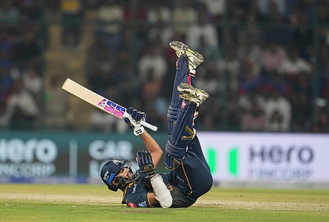 Gujarat Titans' Washington Sundar loses his balance while playing a shot during the Indian Premier League cricket match between Delhi Capitals and Gujarat Titans in New Delhi.