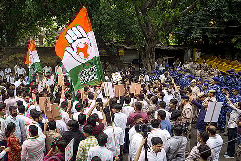 Indian Youth Congress members stage a protest against the use of "derogatory language" against party chief Mallikarjun Kharge by Assam Chief Minister Himanta Biswa Sarma, in New Delhi.
