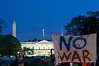 AP Photo/Jose Luis Magana : Activists protest at Lafayette Park near the White House in Washington, Tuesday evening, April 7, 2026. 