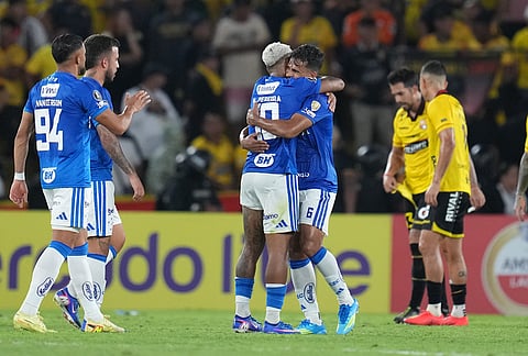 Players of Brazil's Cruzeiro celebrate at the end of the game against Ecuador's Barcelona during a Copa Libertadores soccer Group D match in Guayaquil, Ecuador.