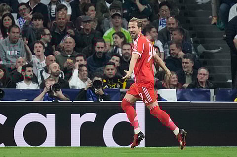 Bayern's Harry Kane celebrates after scoring his side's second goal during the Champions League quarterfinal first leg soccer match between Real Madrid and Bayern Munich in Madrid, Spain.