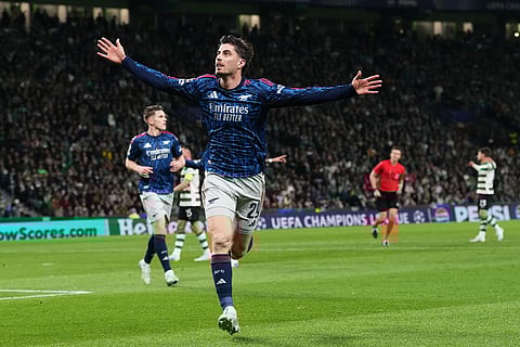 Arsenal's Kai Havertz celebrates after scoring his sides first goal during the Champions League quarterfinals, first leg, soccer match between Sporting CP and Arsenal, in Lisbon.