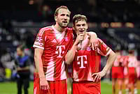 Real Madrid Vs Bayern Munich, UEFA Champions League Quarter-Final: Bavarians Take First Leg Honours | Photo: AP/Jose Breton : Bayern's Harry Kane, left, and teammate Joshua Kimmich look at the fans after the Champions League quarterfinal first leg soccer match between Real Madrid and Bayern Munich in Madrid, Spain.