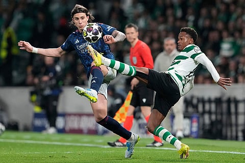 Sporting's Geny Catamo, right, challenges Arsenal's Riccardo Calafiori during the Champions League quarterfinals, first leg, soccer match between Sporting CP and Arsenal, in Lisbon.