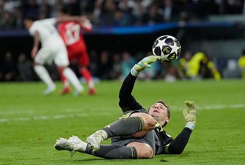 Bayern's goalkeeper Manuel Neuer saves the ball during the Champions League quarterfinal first leg soccer match between Real Madrid and Bayern Munich in Madrid, Spain.