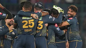 AP/Manish Swarup : Gujarat Titans' players celebrate after they won the Indian Premier League match against Delhi Capitals in New Delhi.