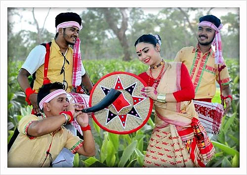 Bihu dancers with Pepa and Japi in a green field