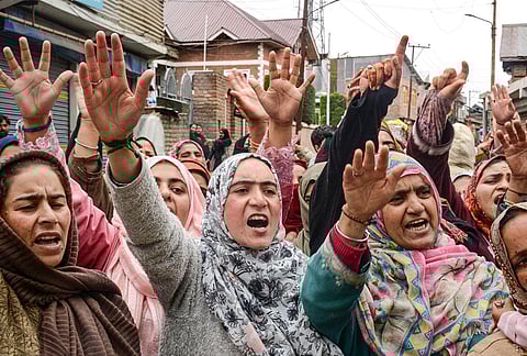 People raise slogans as they gather to celebrate in response to the ceasefire agreement between Iran, the United States and Israel, after US President Donald Trump pulled back from his threats to destroy Iranian civilization, in Srinagar, Jammu and Kashmir.