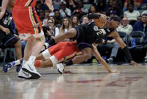 Utah Jazz forward Blake Hinson (2) battles New Orleans Pelicans guard Micah Peavy (14) during the first half of an NBA basketball game in New Orleans.