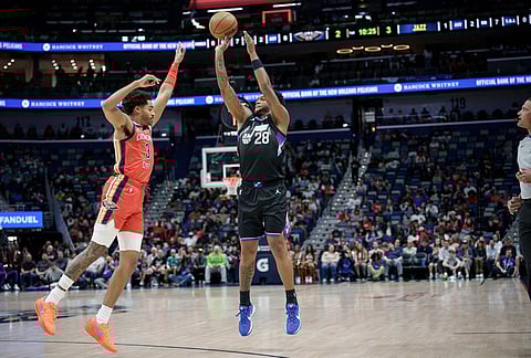 Utah Jazz forward Brice Sensabaugh (28) shoots over New Orleans Pelicans guard Jordan Poole (3) during the first half of an NBA basketball game in New Orleans.