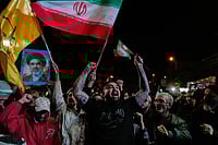 Day In Pics: April 08, 2026 | Photo: AP/Vahid Salemi : Pro-government demonstrators chant slogans as they hold Iranian flags and a poster of the Supreme Leader Ayatollah Mojtaba Khamenei in a gathering after announcement of a two-week ceasefire in the war with the United States and Israel, at the Enqelab-e-Eslami, or Islamic Revolution, Square, in Tehran, Iran.