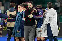 Sporting 0-1 Arsenal, UEFA Champions League Quarter-Final: Havertz, Raya Star In Gunners' Fighting 1st Leg Win | Photo: AP/Armando Franca : Arsenal's manager Mikel Arteta hugs with Arsenal's Gabriel Martinelli after the Champions League quarterfinals, first leg, soccer match between Sporting CP and Arsenal, in Lisbon.