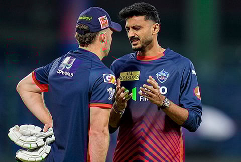 Delhi Capitals' captain Axar Patel, right, during a warm-up session ahead of an Indian Premier League (IPL) 2026 T20 cricket match between Delhi Capitals and Gujarat Titans, at Arun Jaitley Stadium, in New Delhi.