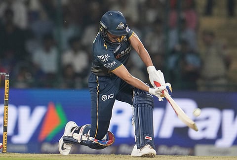 Gujarat Titans' captain Shubman Gill hits a six during the Indian Premier League cricket match between Delhi Capitals and Gujarat Titans in New Delhi.