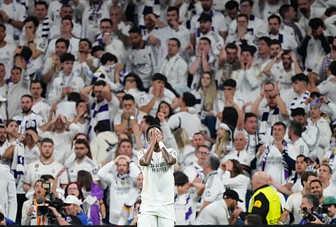 Real Madrid's Vinicius Junior reacts after missing a chance to score during the Champions League quarterfinal first leg soccer match between Real Madrid and Bayern Munich in Madrid, Spain.