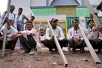 | Photo: Suresh K Pandey/Outlook : Daily-wage labourers in Noida's Khora Colony labour market, waiting to be hired for a day's work.