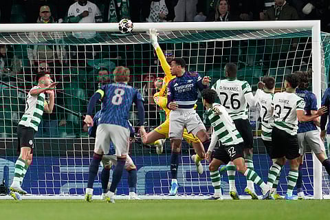 Sporting's goalkeeper Rui Silva soars through the air as the ball hits the upper bar during the Champions League quarterfinals, first leg, soccer match between Sporting CP and Arsenal, in Lisbon.