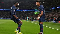 Ligue 1 Matchday 29 Preview: Key Matchups, Players To Watch, Injury List – All You Need To Know | Photo: AP/Thibault Camus : PSG's Desire Doue, right, celebrates with PSG's Ousmane Dembele after scoring the opening goal during the Champions League quarterfinal first leg soccer match between Paris Saint-Germain and Liverpool in Paris, Wednesday, April 8, 2026.