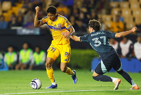 Snyder Brunell of the United States' Seattle Sounders, right, challenges Ozziel Herrera of Mexico's Tigres during a CONCACAF Champions Cup quarterfinal first leg soccer match in Monterrey, Mexico.
