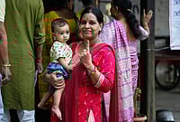 Dance Of Democracy: Streets Abuzz As People Cast Their Votes In Kerala, Assam And Puducherry | Photo: AP/Anupam Nath : A woman shows the indelible ink mark on her index finger after casting her vote at a polling center during the state election in Guwahati.