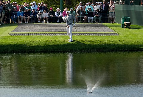 Rory McIlroy, of Northern Ireland, skips a ball on the 16th hole during a practice round ahead of the Masters golf tournament at the Augusta National Golf Club, in Augusta, Georgia.