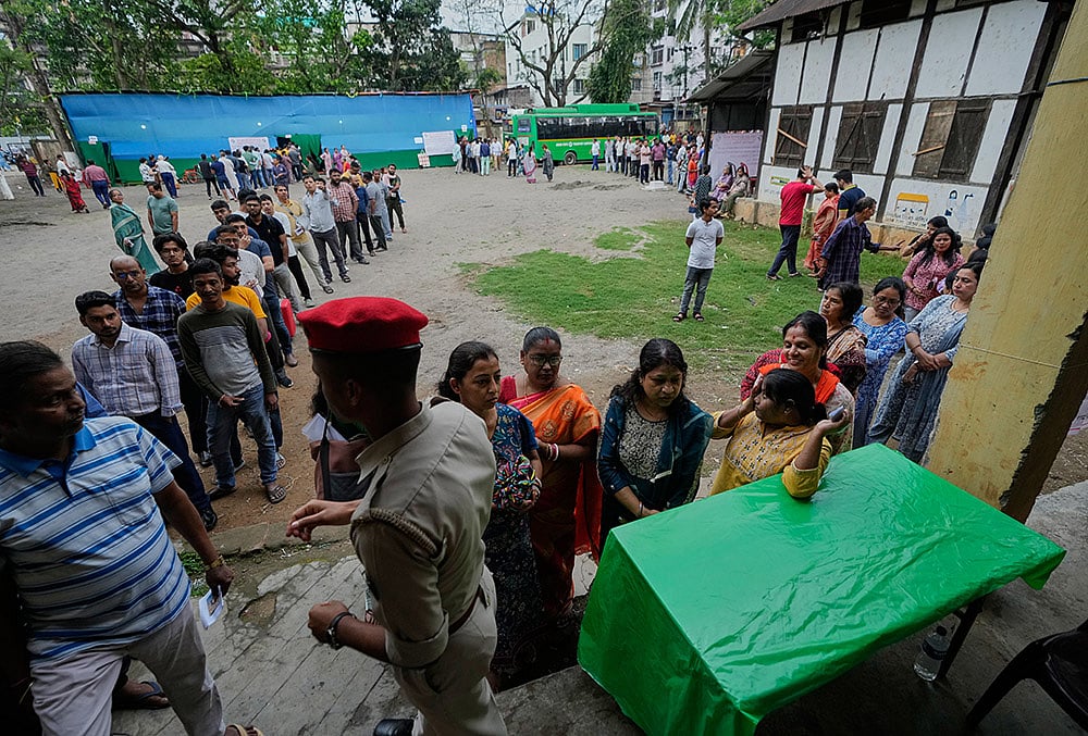 Assembly elections voting-People stand in queue in guwahati