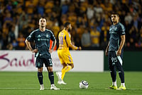 | Photo: AP/Jorge Mendoza : Albert Rusnak, left, and Osaze De Rosario of the United States' Seattle Sounders stand on the pitch during a CONCACAF Champions Cup quarterfinal first leg soccer match against Mexico's Tigres in Monterrey, Mexico.