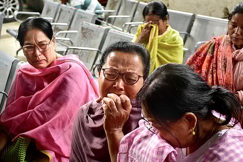 Hijam Ningol Oinam Ongbi Loidang, grandmother of the two children who died in the bomb attack in Bishnupur on Tuesday, mourns during a press meet, at Raj Medicity in Imphal.