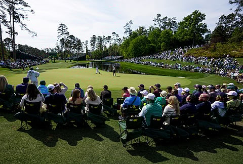 Scottie Scheffler putts on the 16th hole during a practice round ahead of the Masters golf tournament at the Augusta National Golf Club, in Augusta, Georgia.