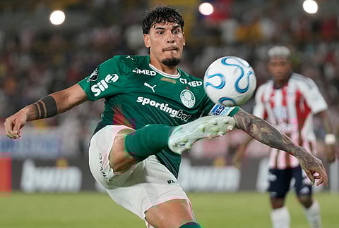 Flaco Lopez of Brazil's Palmeiras kicks the ball during a Copa Libertadores Group F soccer match against Colombia's Junior in Cartagena, Colombia.