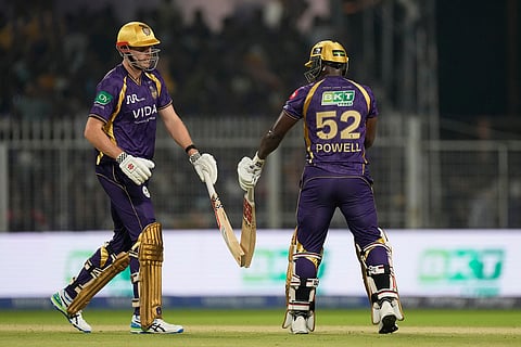 Kolkata Knight Riders' Rovman Powell and Cameron Green bump fists after scoring runs during the Indian Premier League cricket match between Kolkata Knight Riders and Lucknow Super Giants in Kolkata, India.