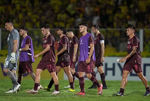 Argentina's Lanus players leave the field after the Copa Libertadores Group G soccer match against Brazil's Mirassol, in Mirassol, Sao Paulo state.