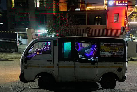 Polling officials travel in a vehicle to help elderly voters cast their votes using postal ballots ahead of the state assembly election in Guwahati, India, Tuesday, March 31, 2026. 
