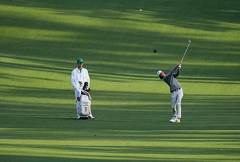 Ethan Fang hits from the fairway on the 10th hole during a practice round ahead of the Masters golf tournament at the Augusta National Golf Club, in Augusta, Georgia.