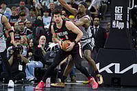 | Photo: AP/Darren Abate : Portland Trail Blazers forward Deni Avdija (8) tangles with San Antonio Spurs forward Harrison Barnes during the second half of an NBA basketball game in San Antonio.