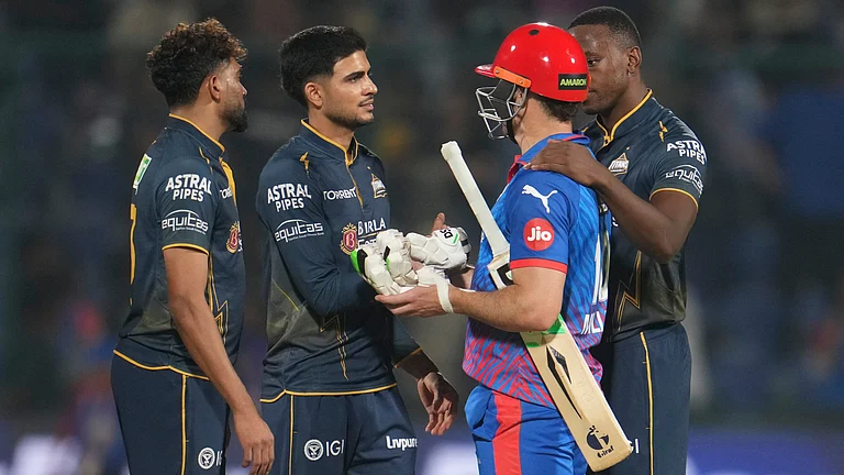 Gujarat Titans' captain Shubman Gill, second from left, shakes hand with Delhi Capitals' David Miller, second from right, after Gujarat Titans won the Indian Premier League cricket match against Delhi Capitals in New Delhi, India, Wednesday, April. 8, 2026 - (AP Photo/ Manish Swarup)