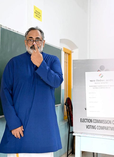 Kerala BJP President Rajeev Chandrasekhar shows his ink-marked finger after casting vote during the state Assembly elections, in Thiruvananthapuram. 