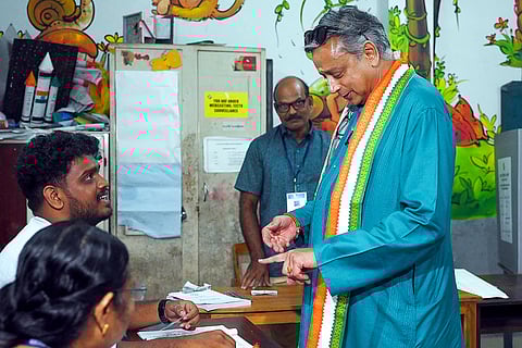 Congress MP Shashi Tharoor casts vote during the Kerala Assembly elections, at a polling station, in Thiruvananthapuram.
