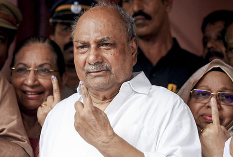 Congress leader AK Antony shows his ink-marked finger after casting vote during the Kerala Assembly elections, at a polling station, in Thiruvananthapuram.