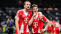 Bundesliga Matchday 29 Preview: Key Matchups, Players To Watch, Injury List – All You Need To Know | Photo: AP/Jose Breton : Bayern's Harry Kane, left, and teammate Joshua Kimmich look at the fans after the Champions League quarterfinal first leg soccer match between Real Madrid and Bayern Munich in Madrid, Spain, Tuesday, April 7, 2026.