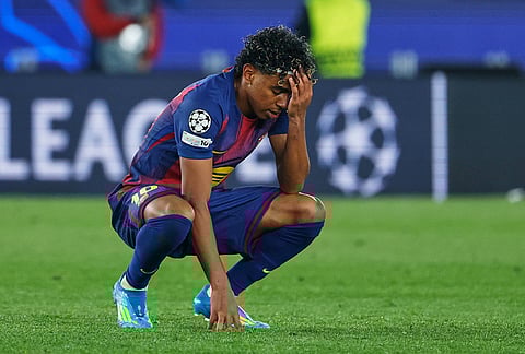 Barcelona's Lamine Yamal reacts disappointed after the Champions League quarterfinal first leg soccer match between Barcelona and Atletico Madrid in Barcelona, Spain.