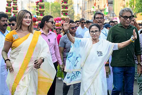 In this image posted on April 9, 2026, West Bengal CM Mamata Banerjee during a roadshow from Dunlop More to Sinthir More ahead of the state Assembly elections.