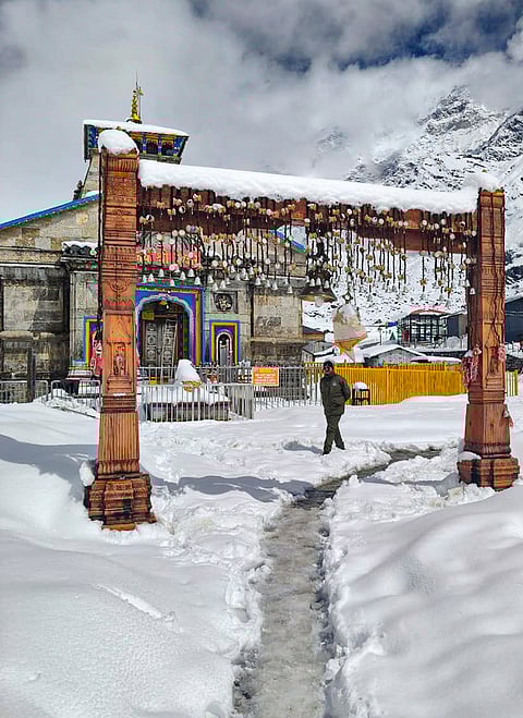 Snow blankets the Kedarnath temple premises following fresh snowfall in the region, in Rudraprayag district, Uttarakhand.