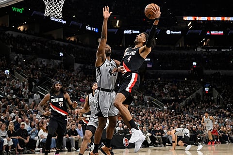 Portland Trail Blazers forward Matisse Thybulle (4) goes to the basket against San Antonio Spurs forward Harrison Barnes during the first half of an NBA basketball game in San Antonio.