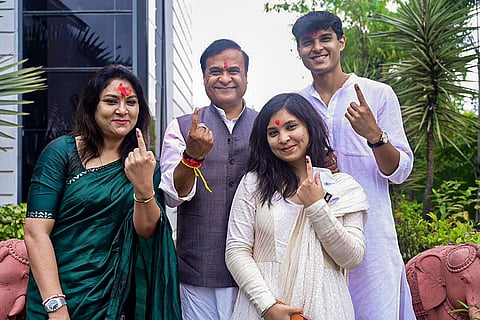 In this image posted on April 9, 2026, Assam Chief Minister Himanta Biswa Sarma and his family members show their ink-marked fingers after casting votes at Jalukbari constituency during the state Assembly elections, in Kamrup district.
