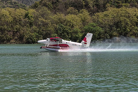 A De Havilland Canada DHC-6 Twin Otter seaplane conducts a test run over the Ganga at Pashulok Barrage, in Rishikesh.