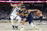 | Photo: AP/David Zalubowski : Denver Nuggets guard Jamal Murray, right, drives to the rim as Memphis Grizzlies guard Lucas Williamson defends in the second half of an NBA basketball game in Denver.